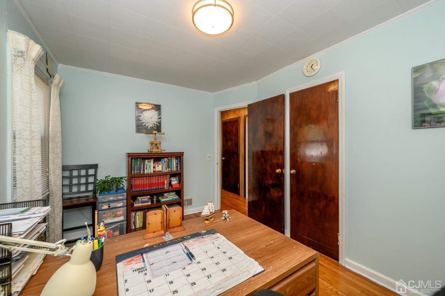 60 Lancaster Road Colonia, NJ 07067 - Photo 23 of 42 a living room with furniture and a flat screen tv