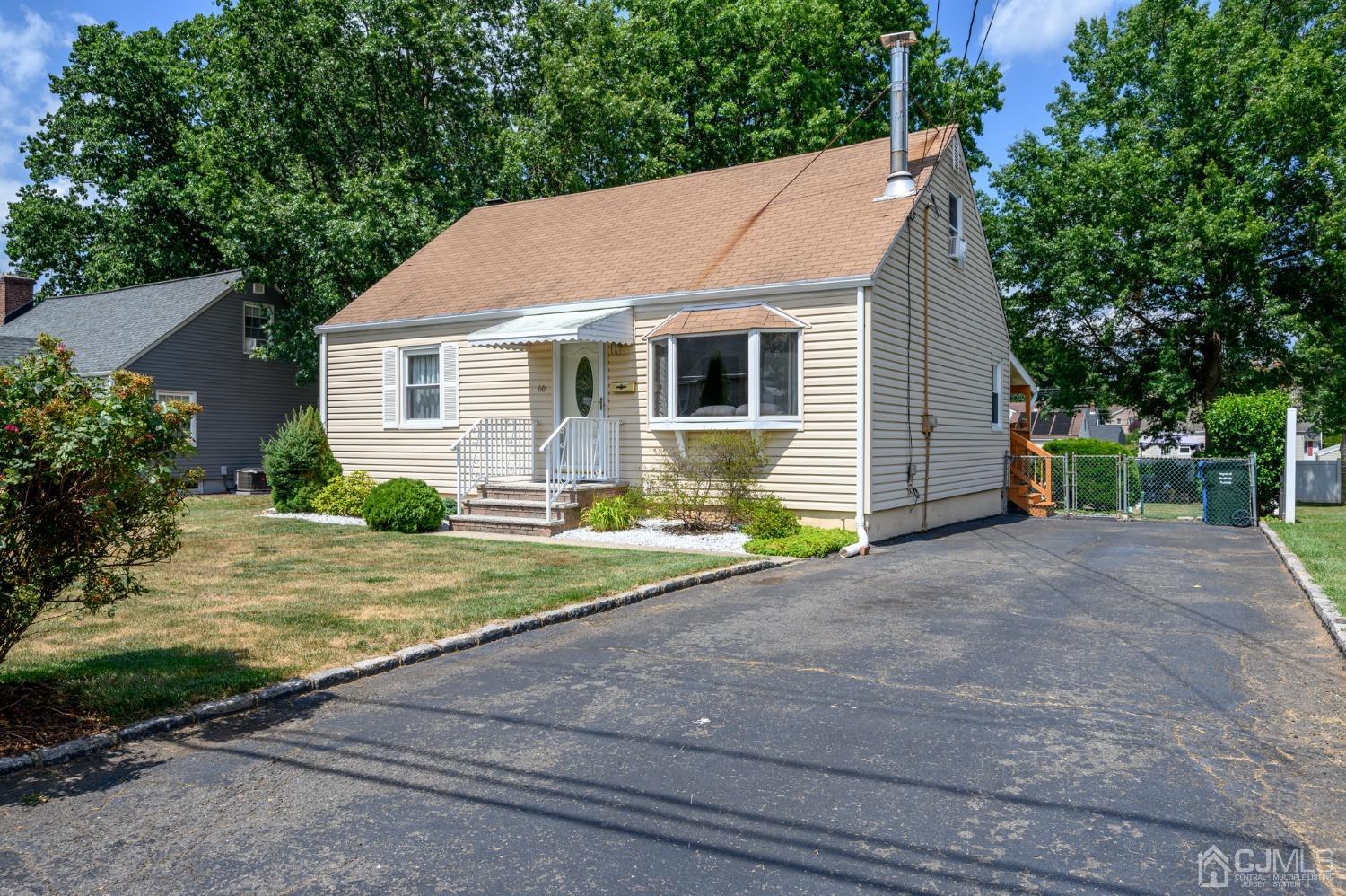 60 Lancaster Road Colonia, NJ 07067 - Photo 3 of 42 a view of a yard in front of a house