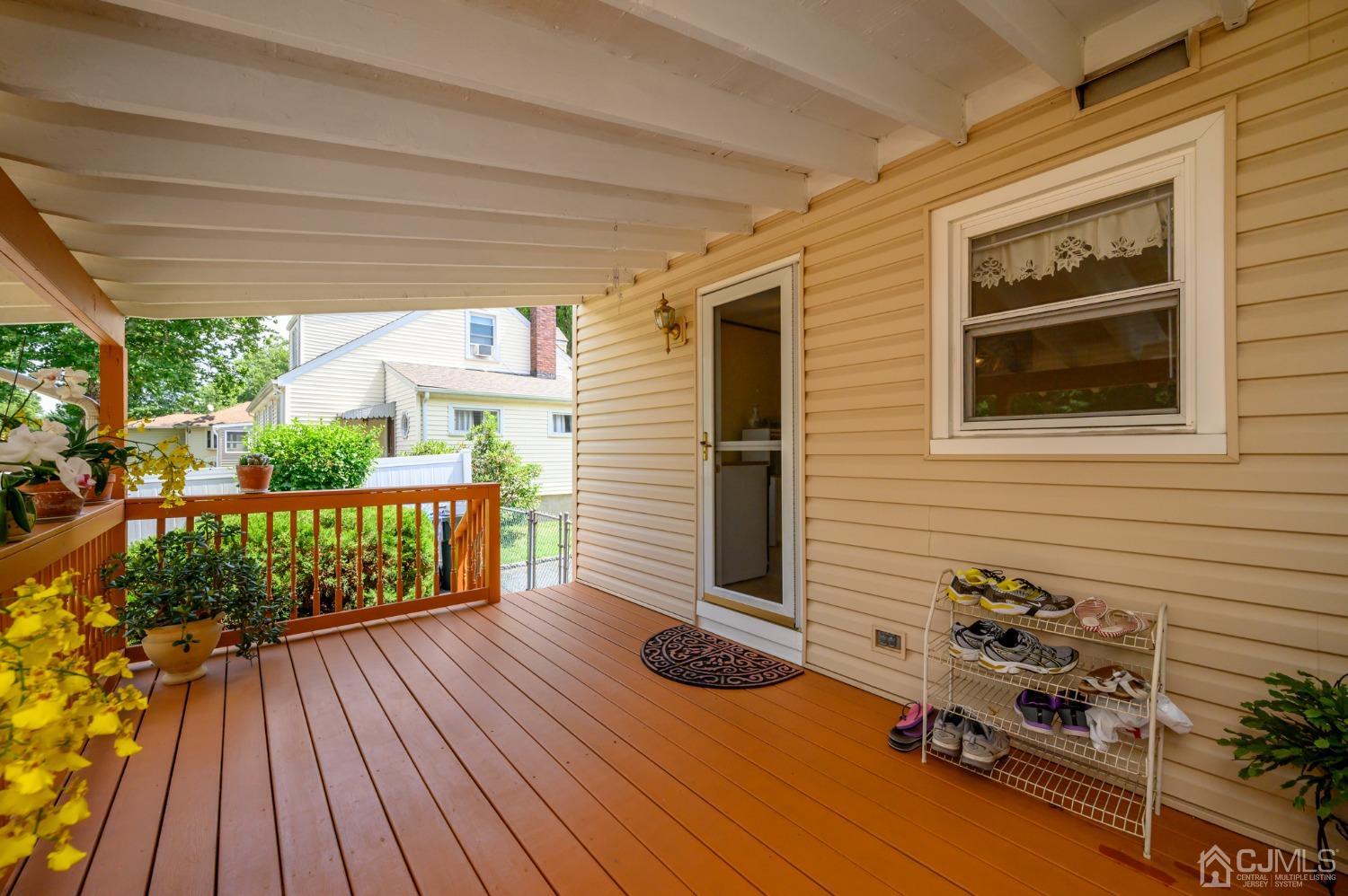 60 Lancaster Road Colonia, NJ 07067 - Photo 7 of 42 a balcony with wooden floor table and chairs