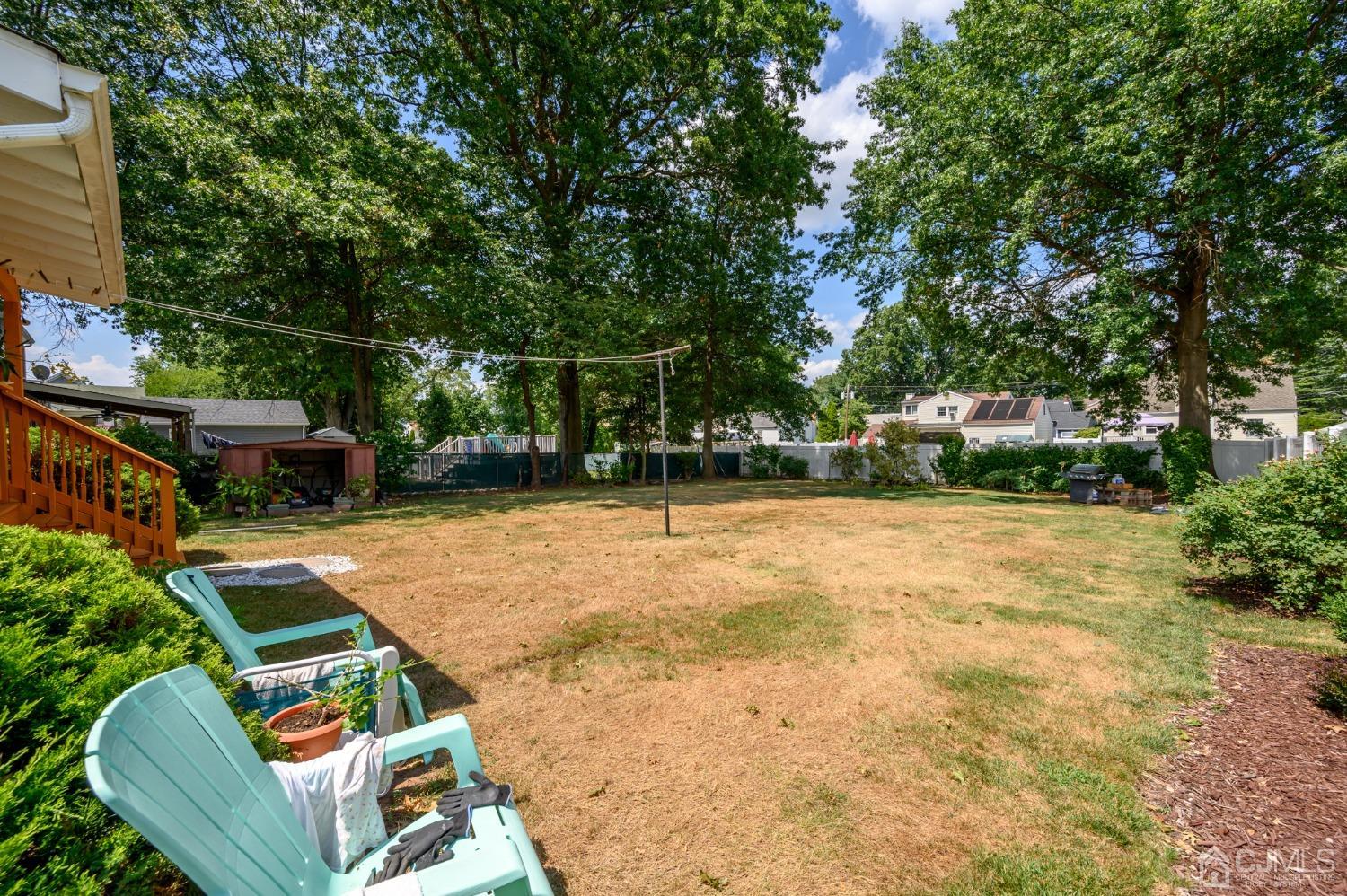 60 Lancaster Road Colonia, NJ 07067 - Photo 8 of 42 a view of backyard with swimming pool and outdoor seating