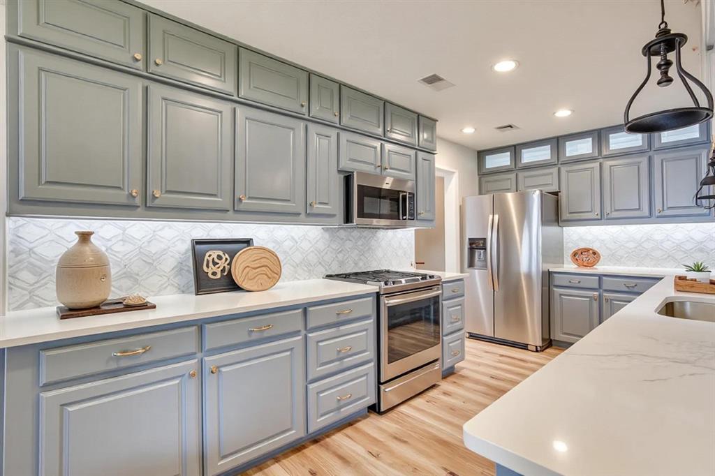 10814 Power Squadron Road Azle, TX 76020 - Photo 6 of 34 a kitchen with stainless steel appliances granite countertop a refrigerator sink and cabinets