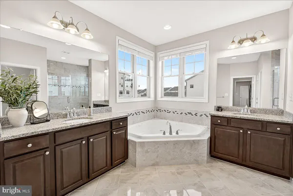 a white toilet sitting next to a bathroom sink