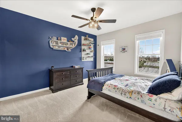 a view of walk in closet with clothes