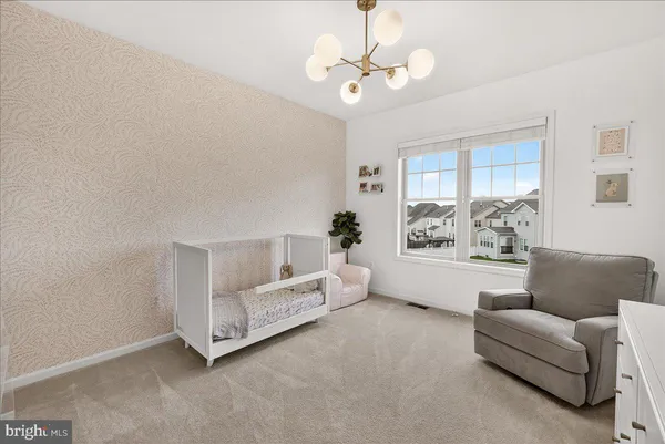 a kitchen with stainless steel appliances a sink a stove and a wooden floor