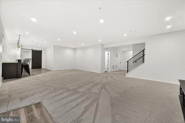 a view of a house with a yard and a garage