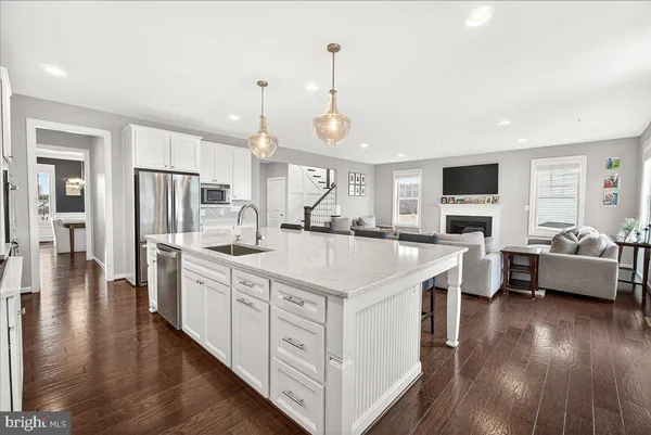 a view of a room with shelves and wooden floor