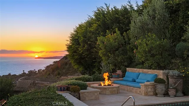 swimming pool view with a seating space
