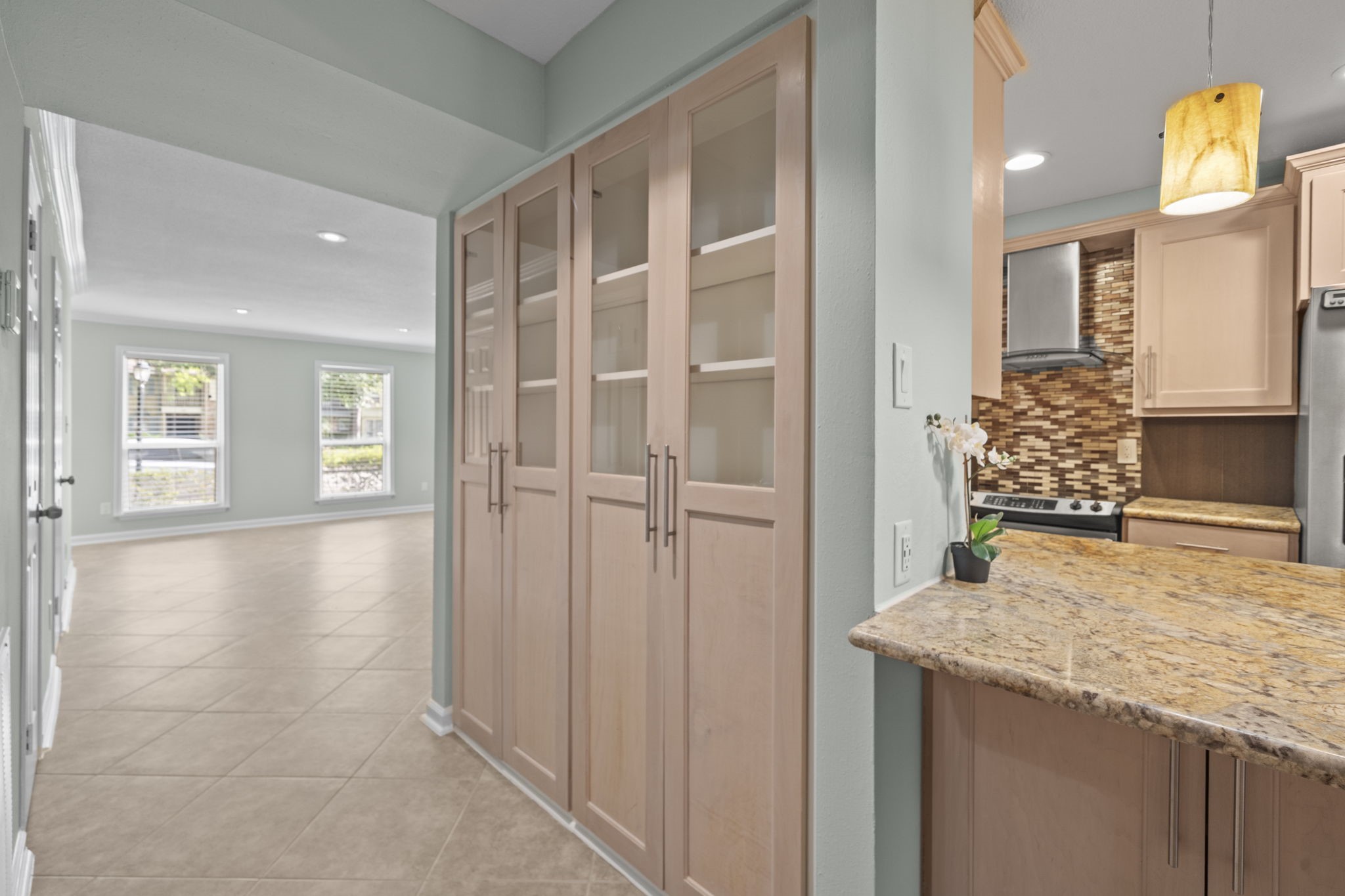 5801 Lumberdale Road, Unit 132 Houston, TX 77092 - Photo 6 of 33 Custom built-in hutch with glass display cabinets and ample storage