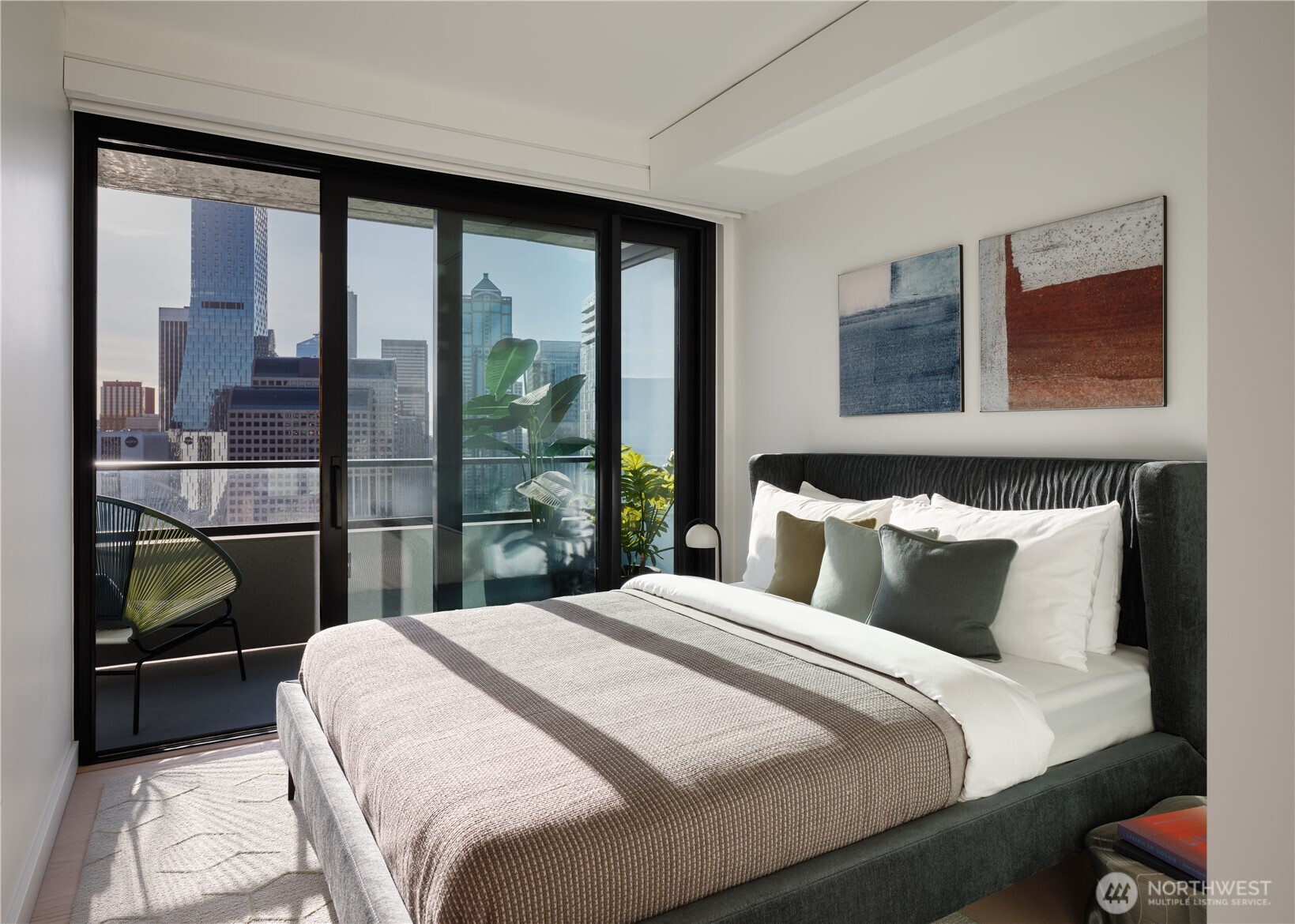 300 Virginia Street, Unit 4405 Seattle, WA 98101 - Photo 11 of 12 a bedroom with a large bed and a window