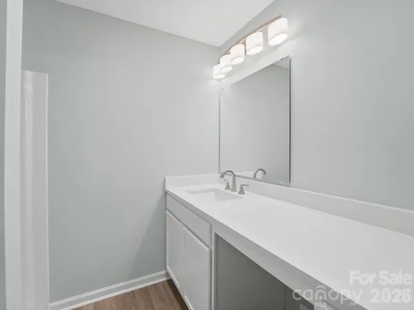a bathroom with a glass shower door
