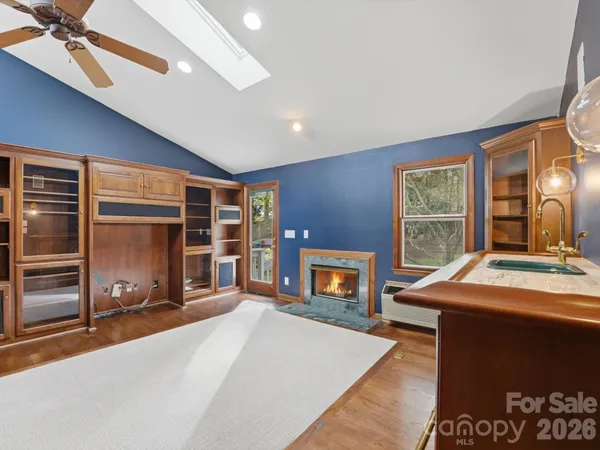 a bed room with a bed and a television