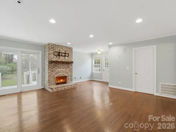 a bedroom with a bed and a fireplace