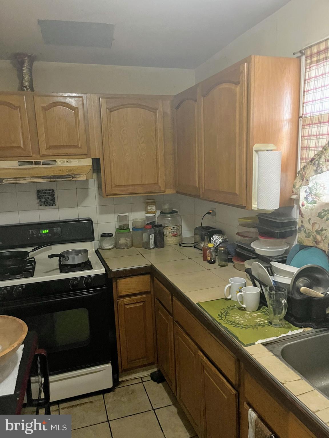 436 Hoffman Street Philadelphia, PA 19148 - Photo 2 of 9 a kitchen with a sink stove and cabinets