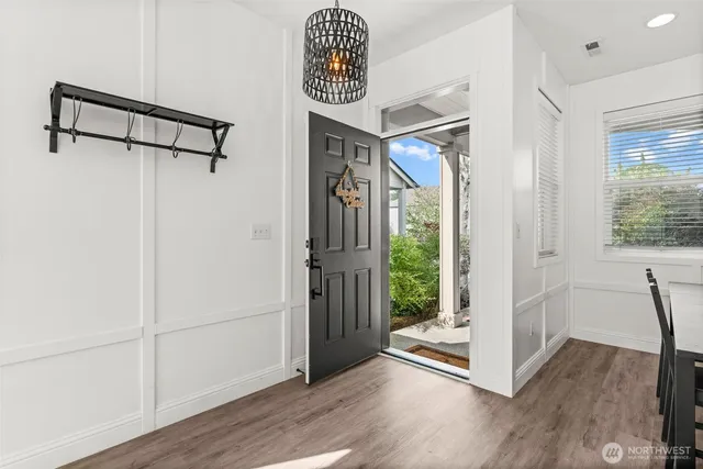 a living room with furniture and kitchen view