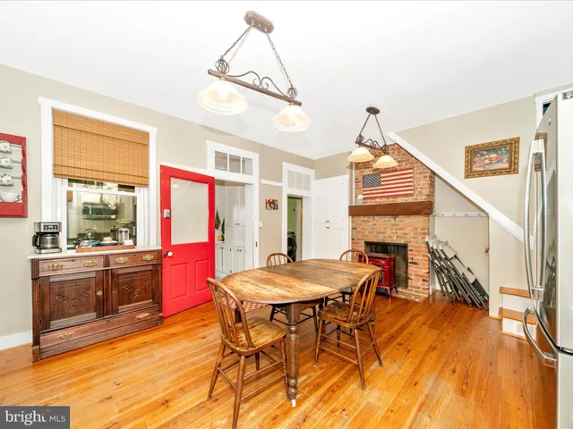 a bathroom with a sink a toilet and shower curtain