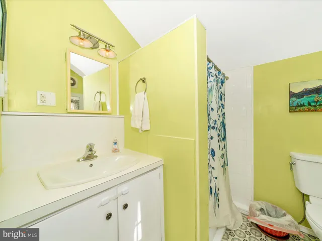 a bedroom with a bed and a table