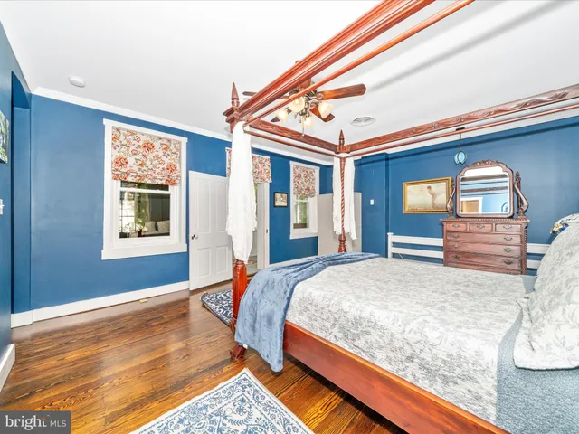 a bedroom with a bed and a fireplace