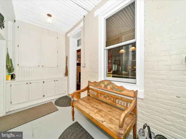 a view of a house with a yard and a fountain