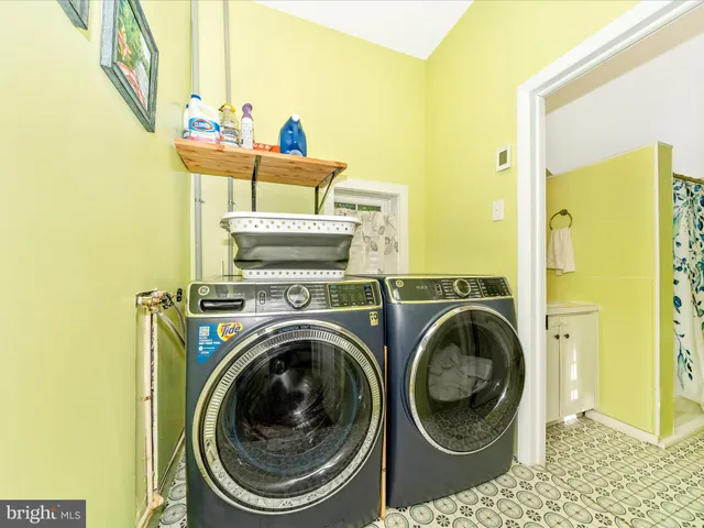 a view of a house with furniture and a yard
