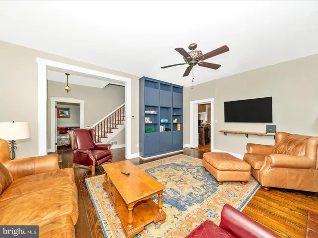 a living room with stainless steel appliances kitchen island granite countertop furniture and a kitchen view