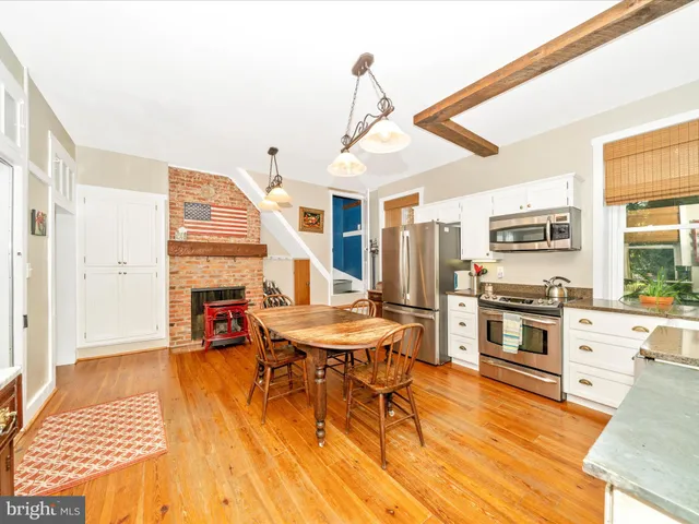 a kitchen with appliances a sink and a stove