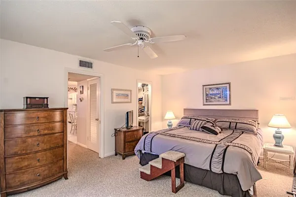 a bedroom with a bed and closet