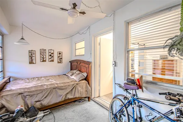 a bedroom with furniture and a window