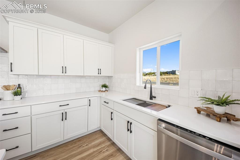442 Gold Canyon Road Canon City, CO 81212 - Photo 5 of 38 a kitchen with white cabinets white appliances and sink