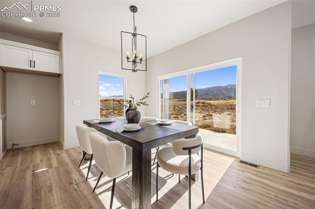442 Gold Canyon Road Canon City, CO 81212 - Photo 9 of 38 a view of a dining room with furniture window and wooden floor