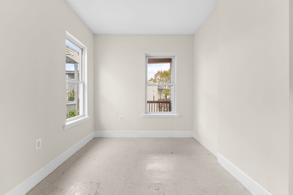 239 Bowdoin Street, Unit 3 Boston, MA 02122 - Photo 11 of 20 an empty room with windows