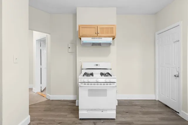 a kitchen with a stove and a microwave