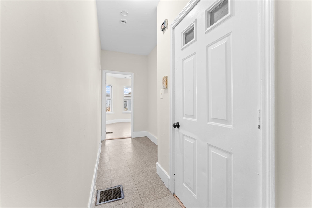 239 Bowdoin Street, Unit 3 Boston, MA 02122 - Photo 2 of 20 a view of a hallway with wooden floor