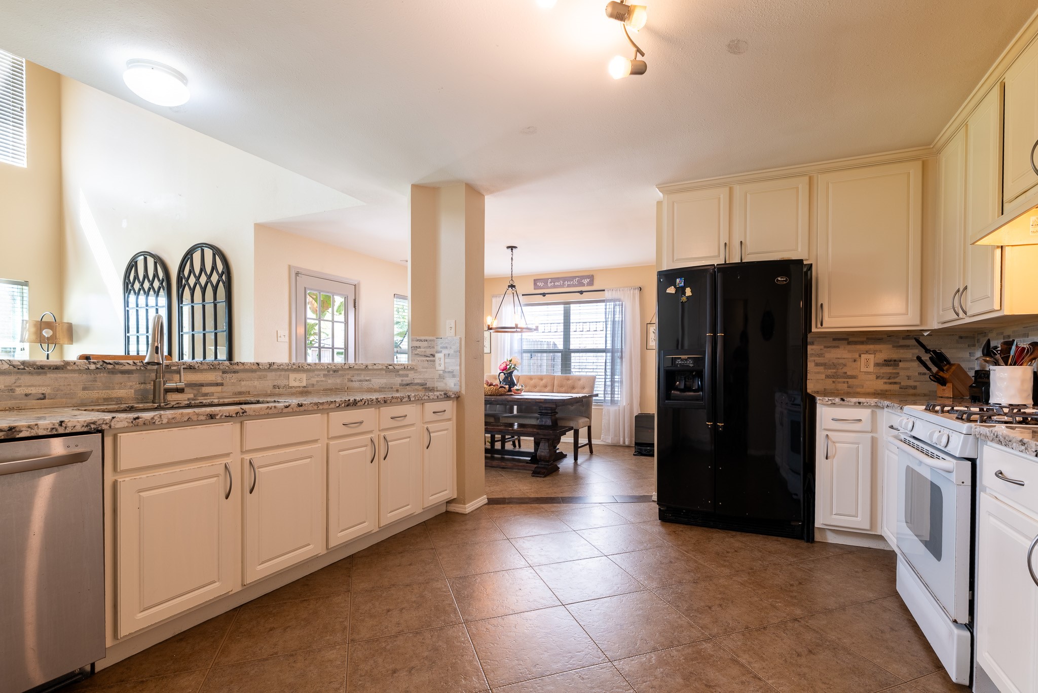 17323 Dakota Ridge Drive Houston, TX 77095 - Photo 12 of 25 a kitchen with a refrigerator and a sink