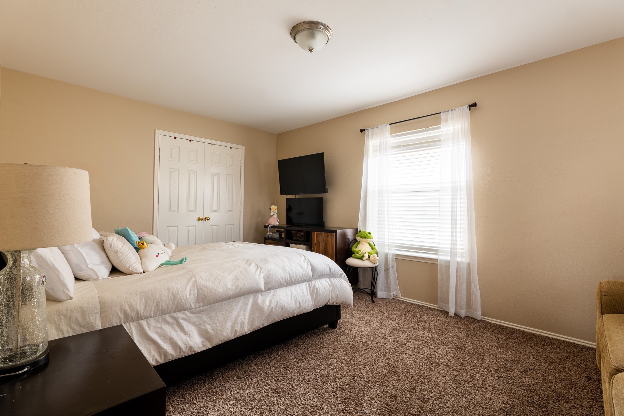 17323 Dakota Ridge Drive Houston, TX 77095 - Photo 18 of 25 a bedroom with a bed and a window