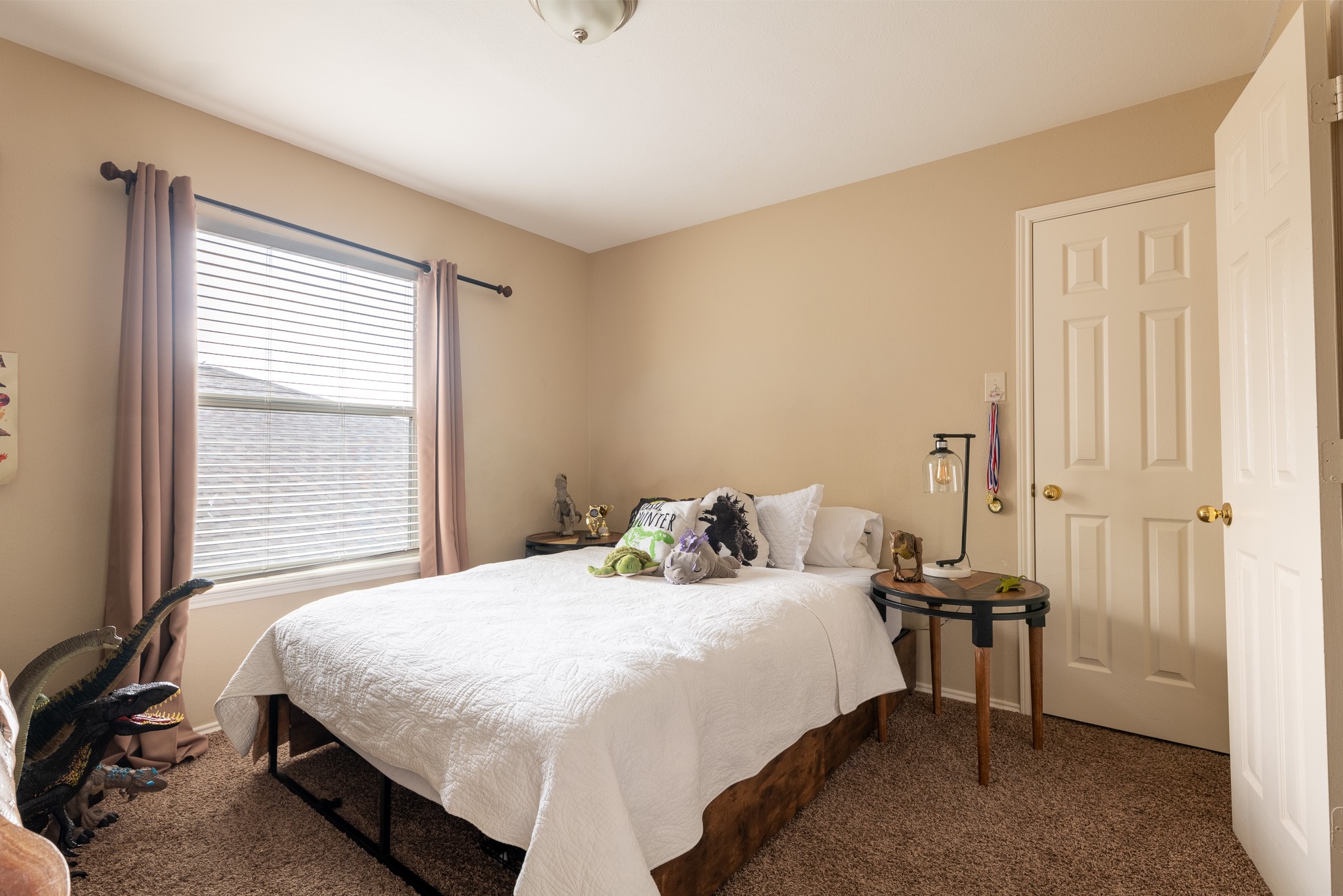 17323 Dakota Ridge Drive Houston, TX 77095 - Photo 20 of 25 a bedroom with a bed and a window