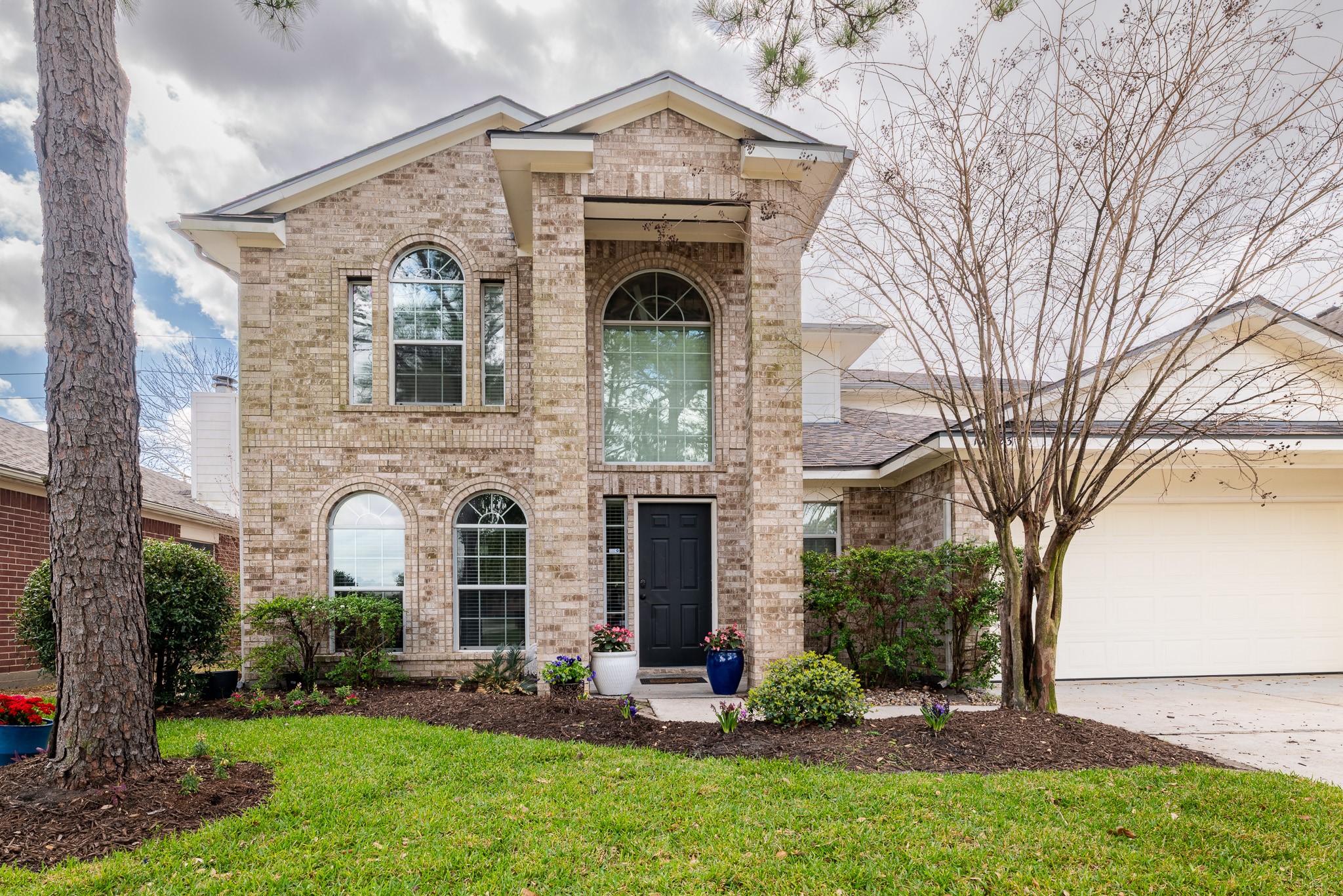17323 Dakota Ridge Drive Houston, TX 77095 - Photo 2 of 25 front view of a house with a yard