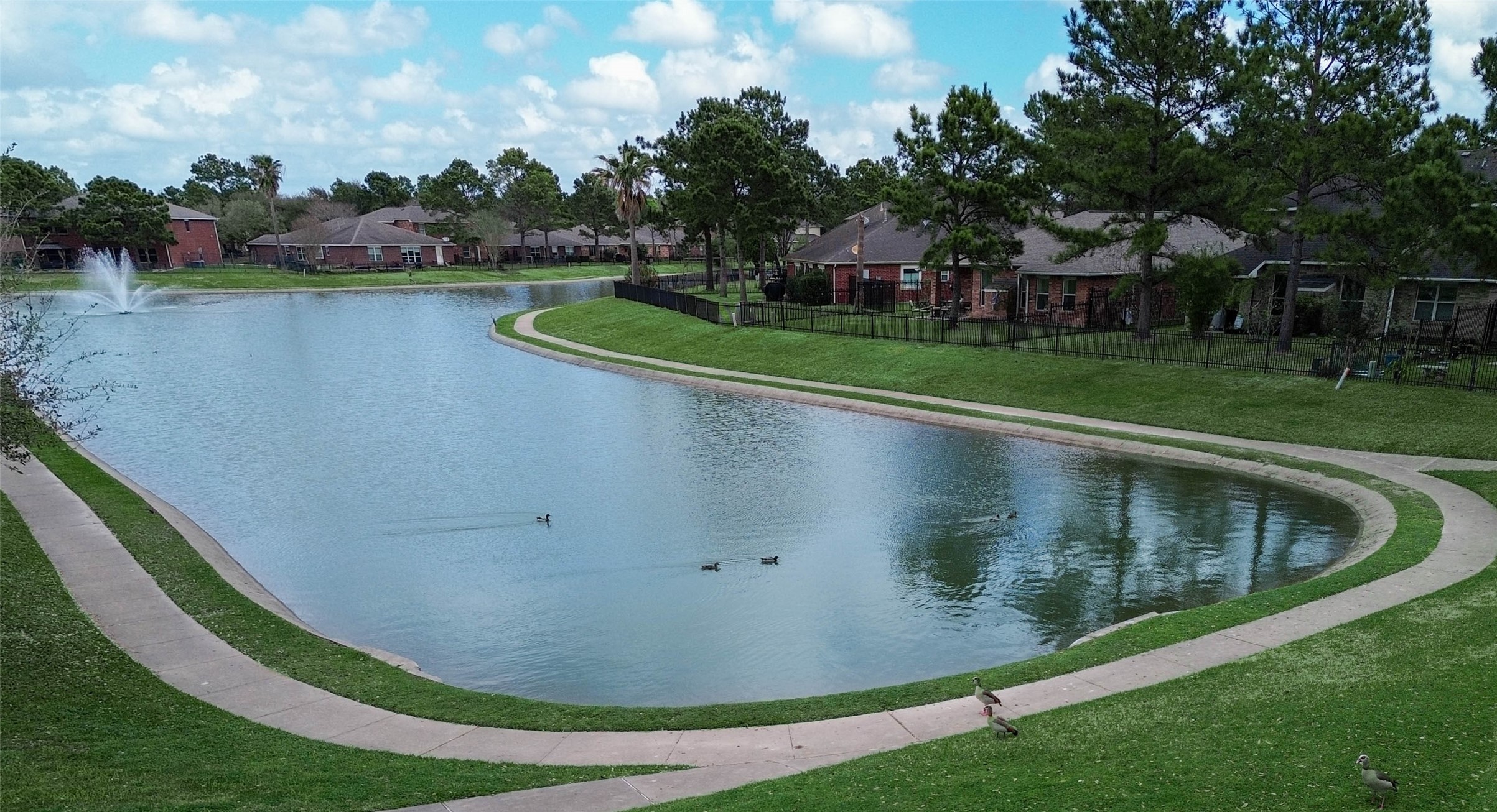 17323 Dakota Ridge Drive Houston, TX 77095 - Photo 25 of 25 a view of a swimming pool with outdoor space and lake view in back
