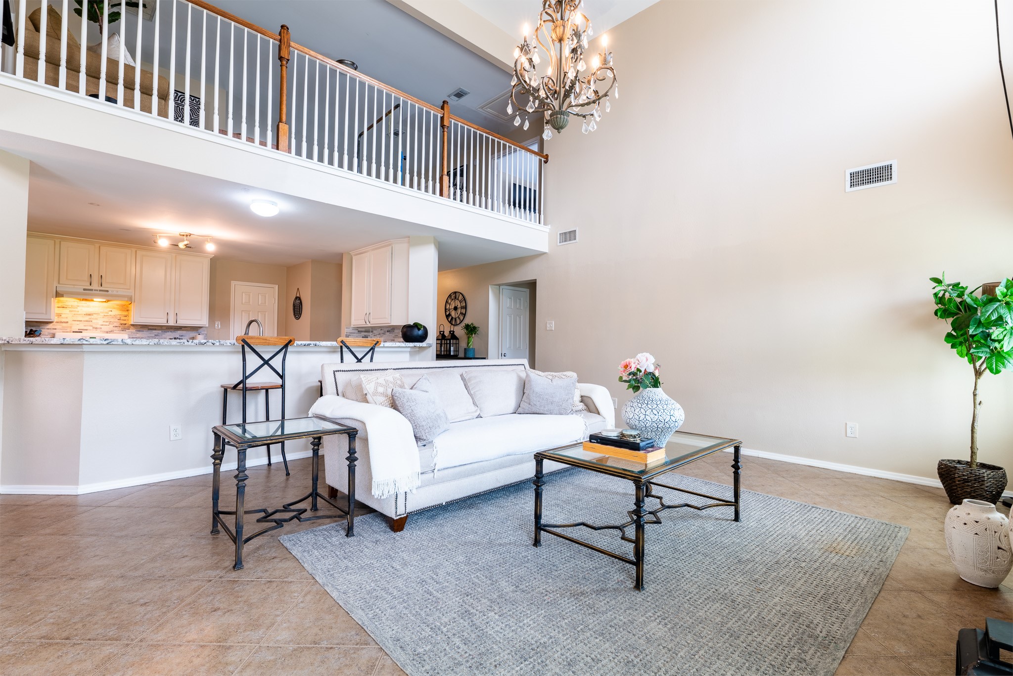 17323 Dakota Ridge Drive Houston, TX 77095 - Photo 6 of 25 a living room with furniture and a chandelier