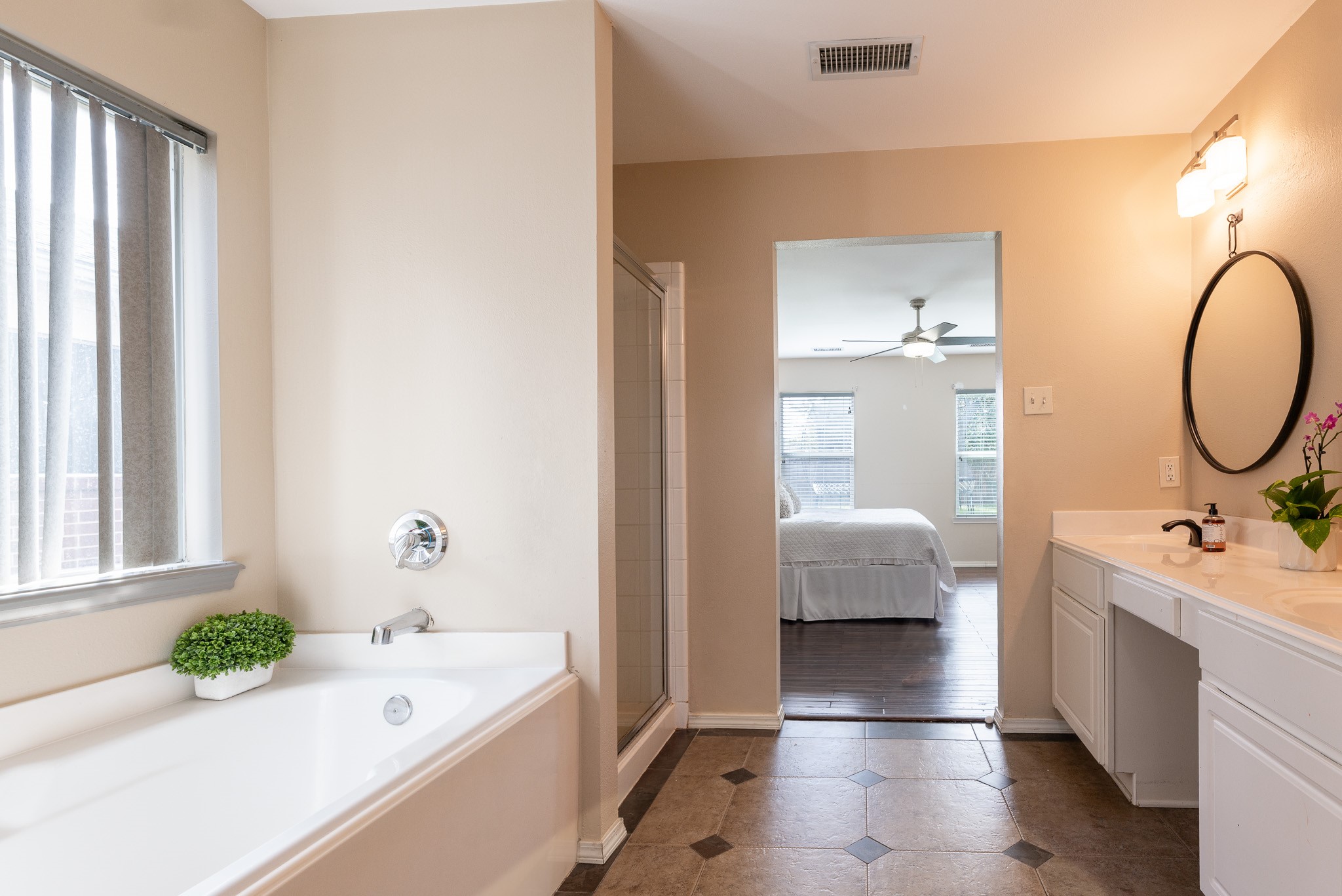 17323 Dakota Ridge Drive Houston, TX 77095 - Photo 10 of 25 a en suite bathroom with a tub sink and mirror
