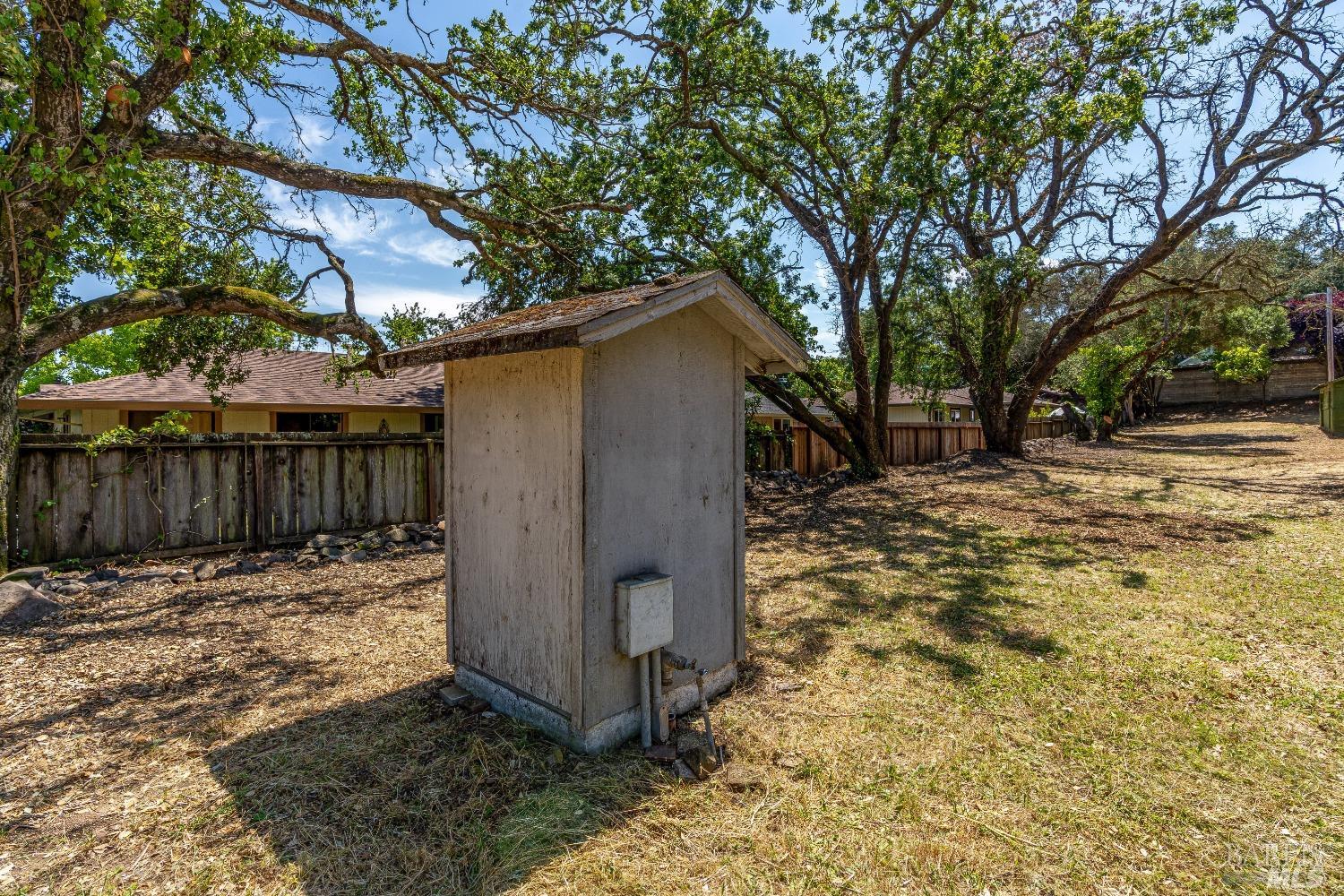 0 Bridgewood Drive Santa Rosa, CA 95404 - Photo 24 of 30 a view of a yard with wooden fence and a large tree