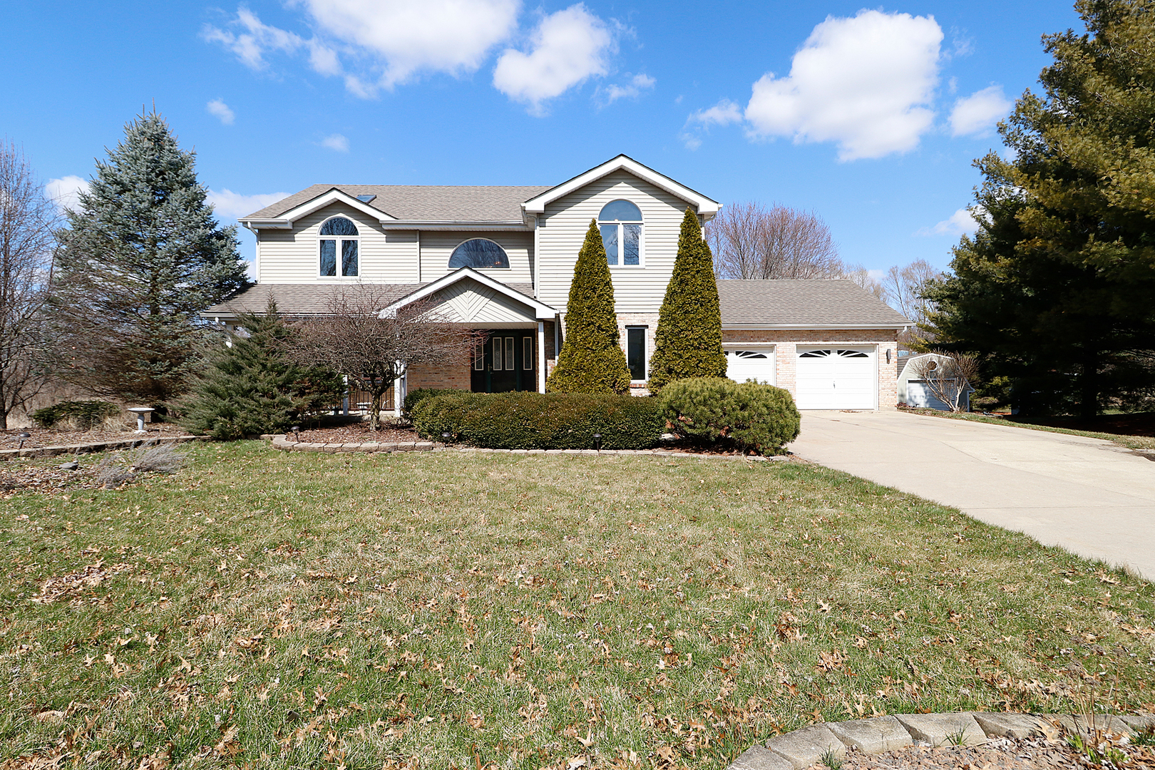 17302 West Rob Avenue Elwood, IL 60421 - Photo 1 of 1 a front view of a house with a yard and garage