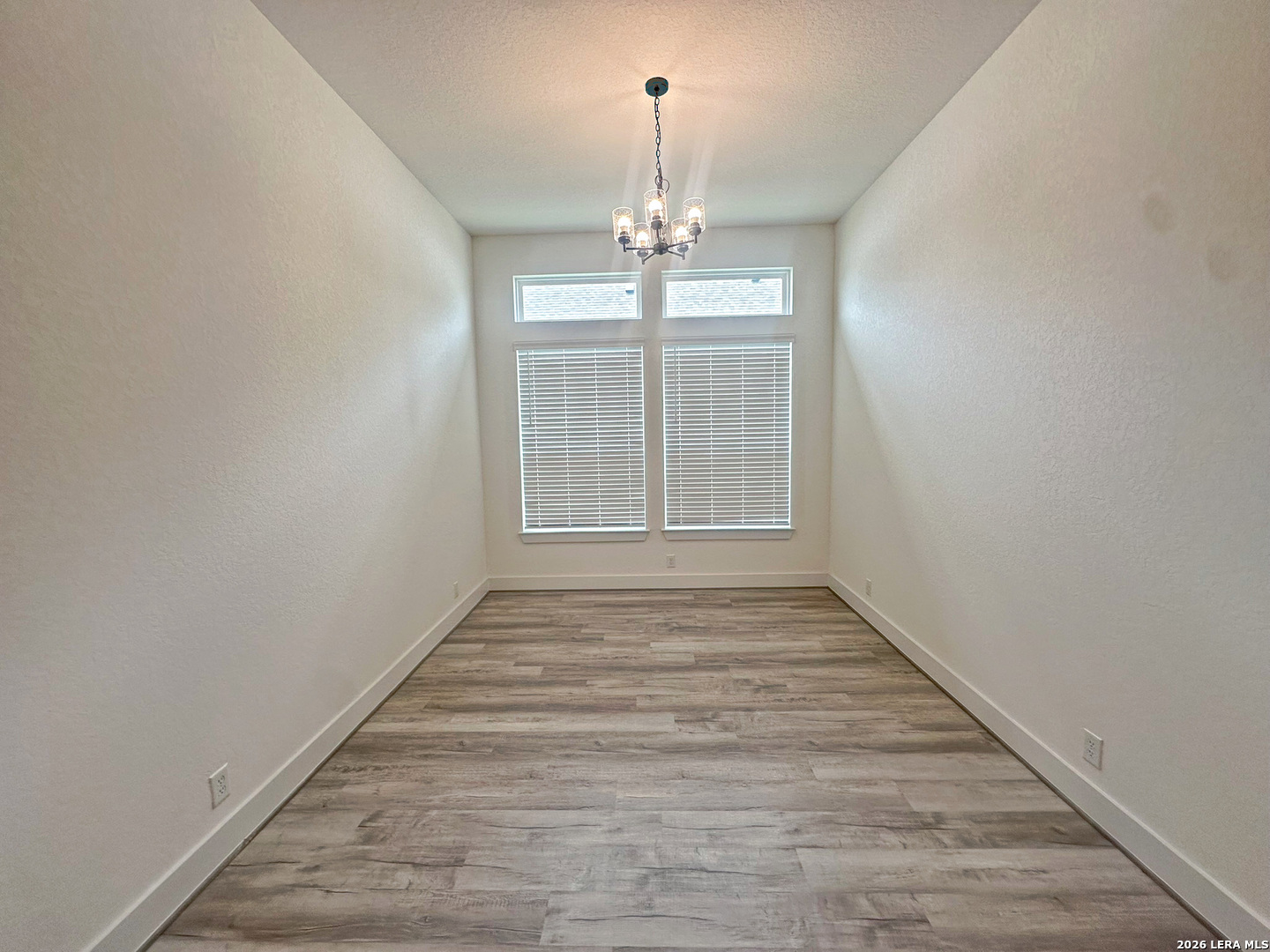 418 Corwin Springs Cibolo, TX 78108 - Photo 13 of 24 wooden floor in an empty room with a window