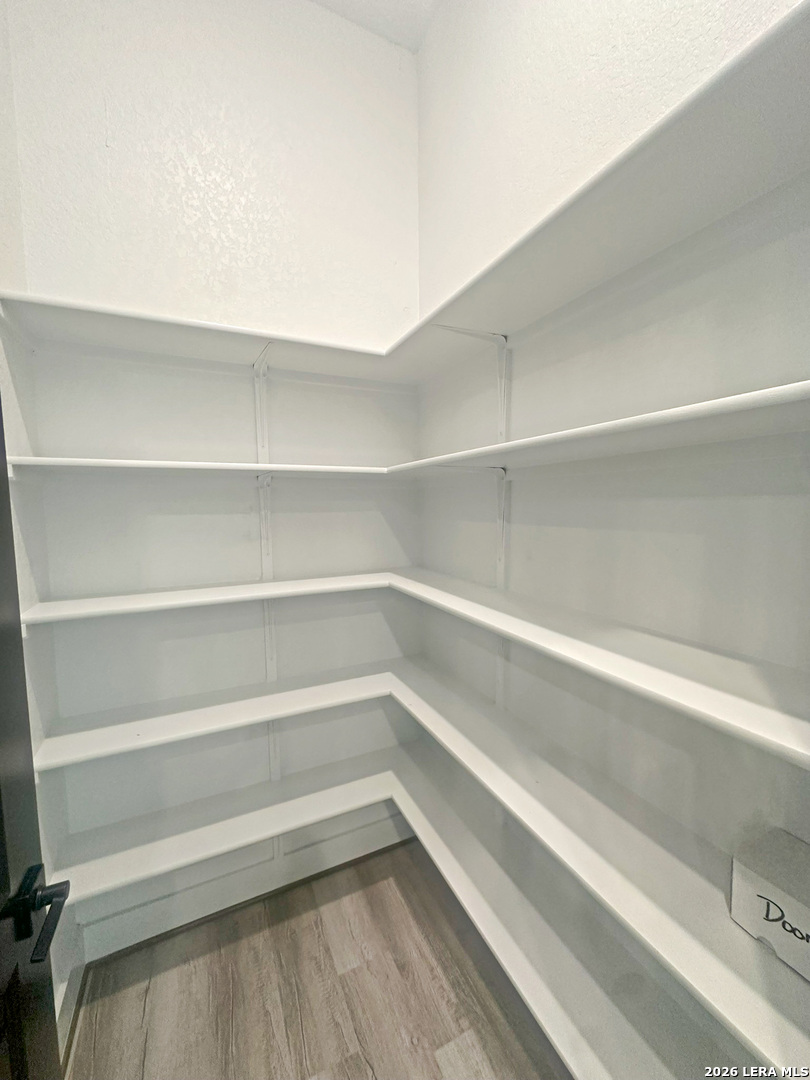 418 Corwin Springs Cibolo, TX 78108 - Photo 14 of 24 a view of walk in closet with empty racks