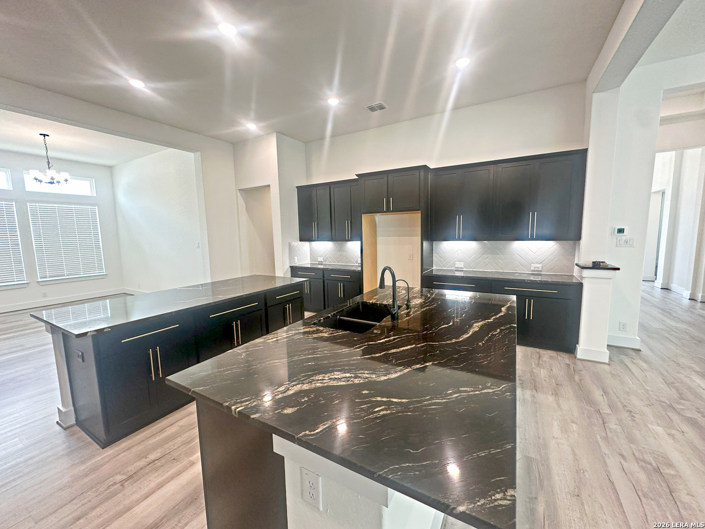 418 Corwin Springs Cibolo, TX 78108 - Photo 16 of 24 a kitchen with stainless steel appliances granite countertop a sink and a microwave