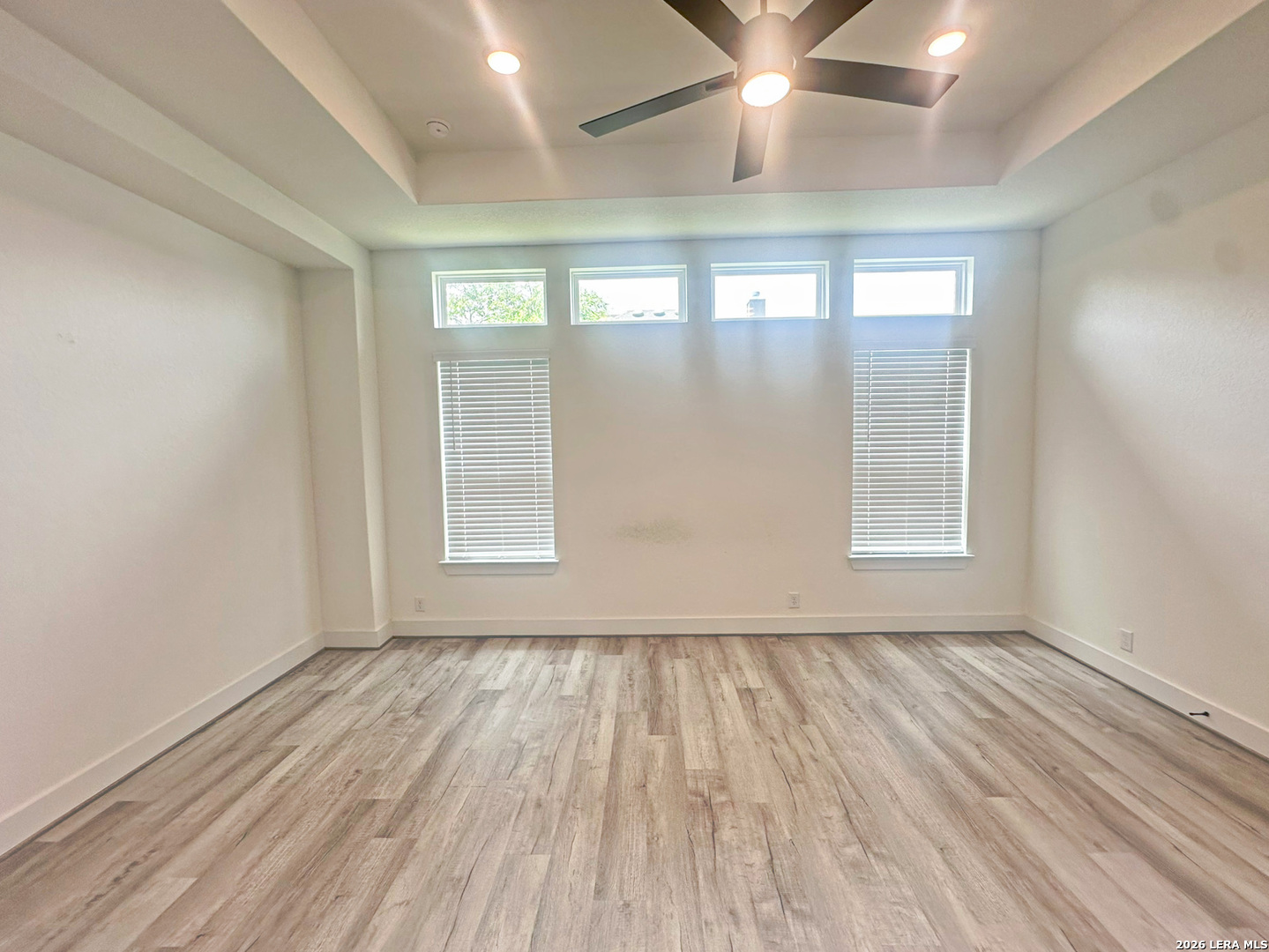 418 Corwin Springs Cibolo, TX 78108 - Photo 18 of 24 wooden floor in an empty room with a window