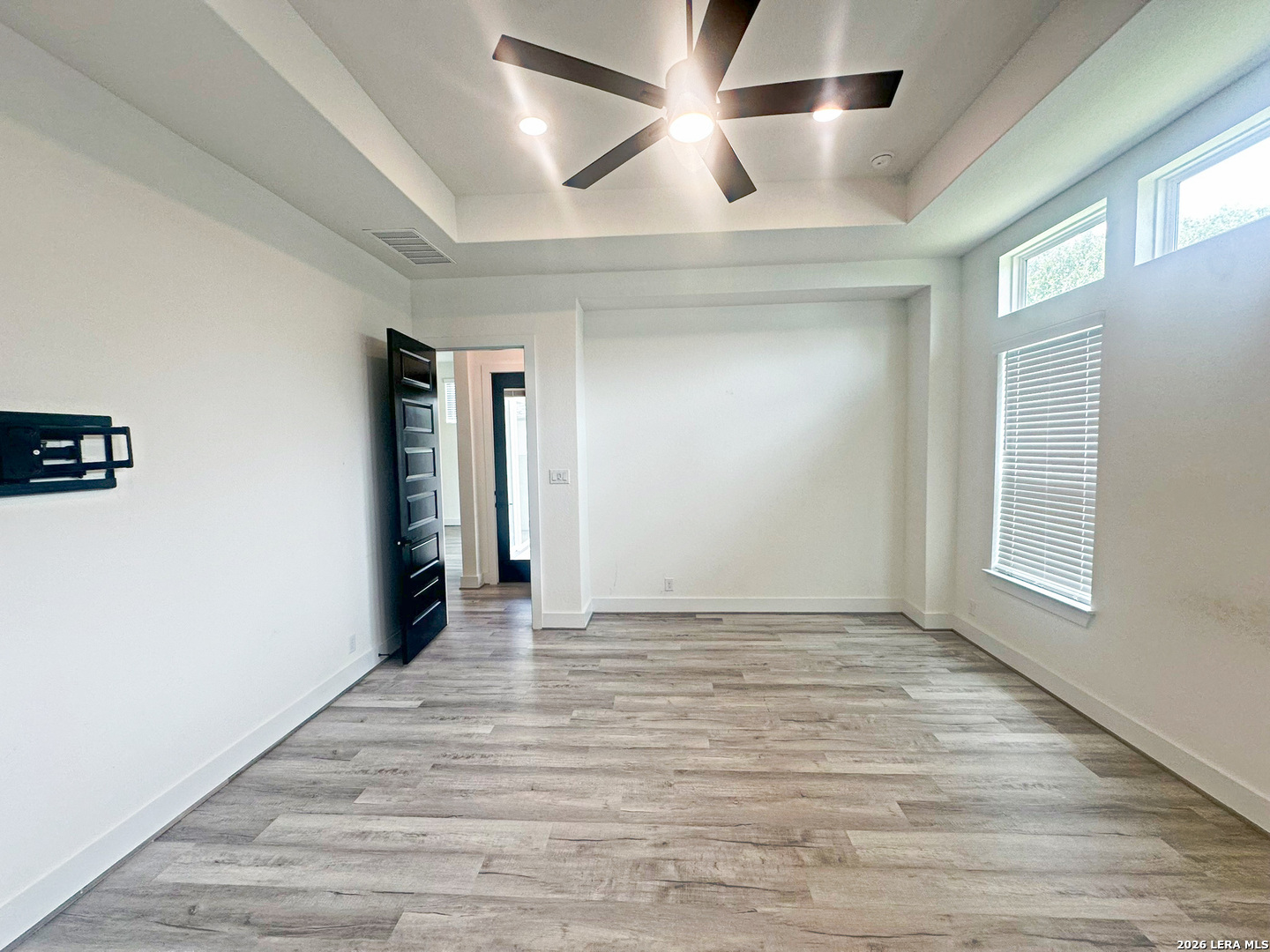 418 Corwin Springs Cibolo, TX 78108 - Photo 19 of 24 an empty room with wooden floor and windows