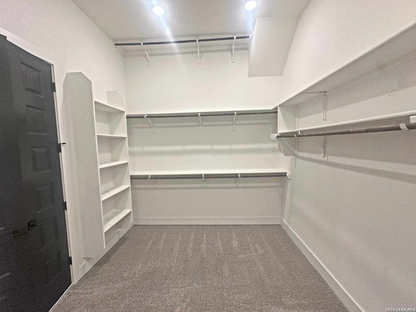 418 Corwin Springs Cibolo, TX 78108 - Photo 21 of 24 a storage room with cabinets