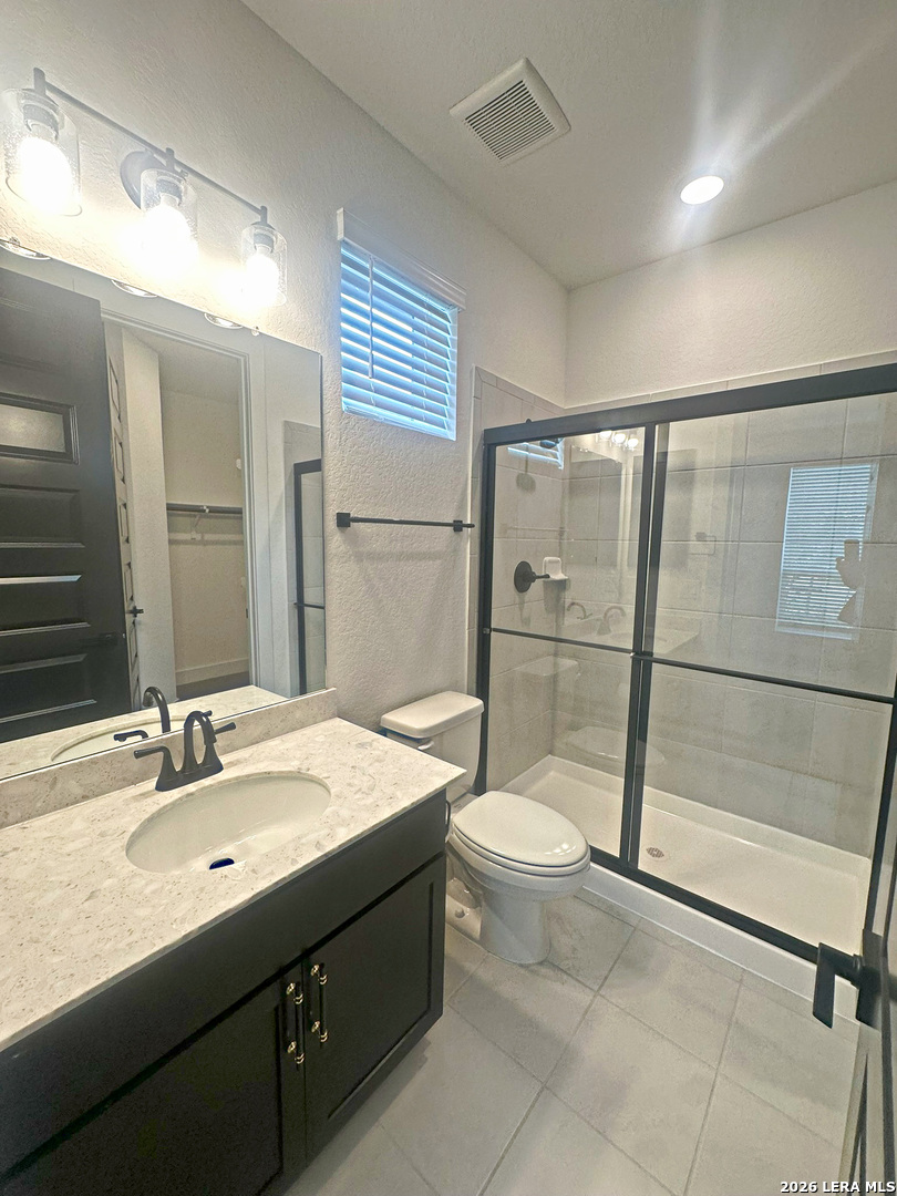 418 Corwin Springs Cibolo, TX 78108 - Photo 5 of 24 a bathroom with a sink toilet and shower