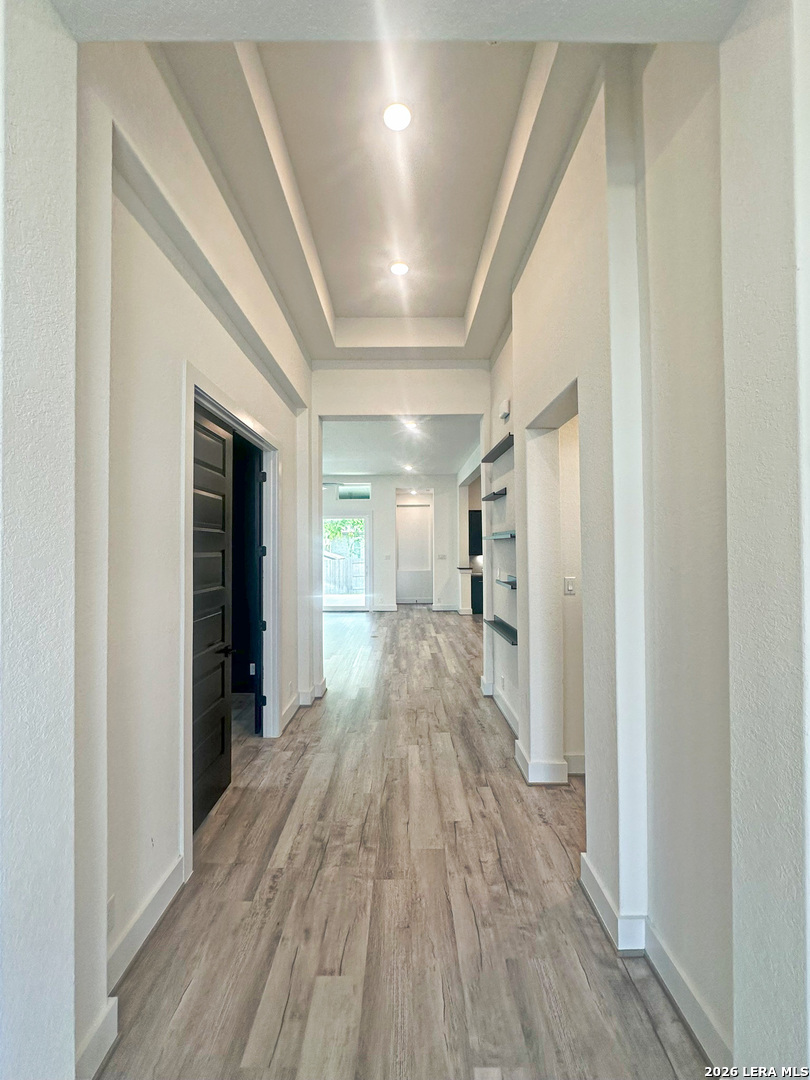418 Corwin Springs Cibolo, TX 78108 - Photo 6 of 24 a view of hallway with wooden floor