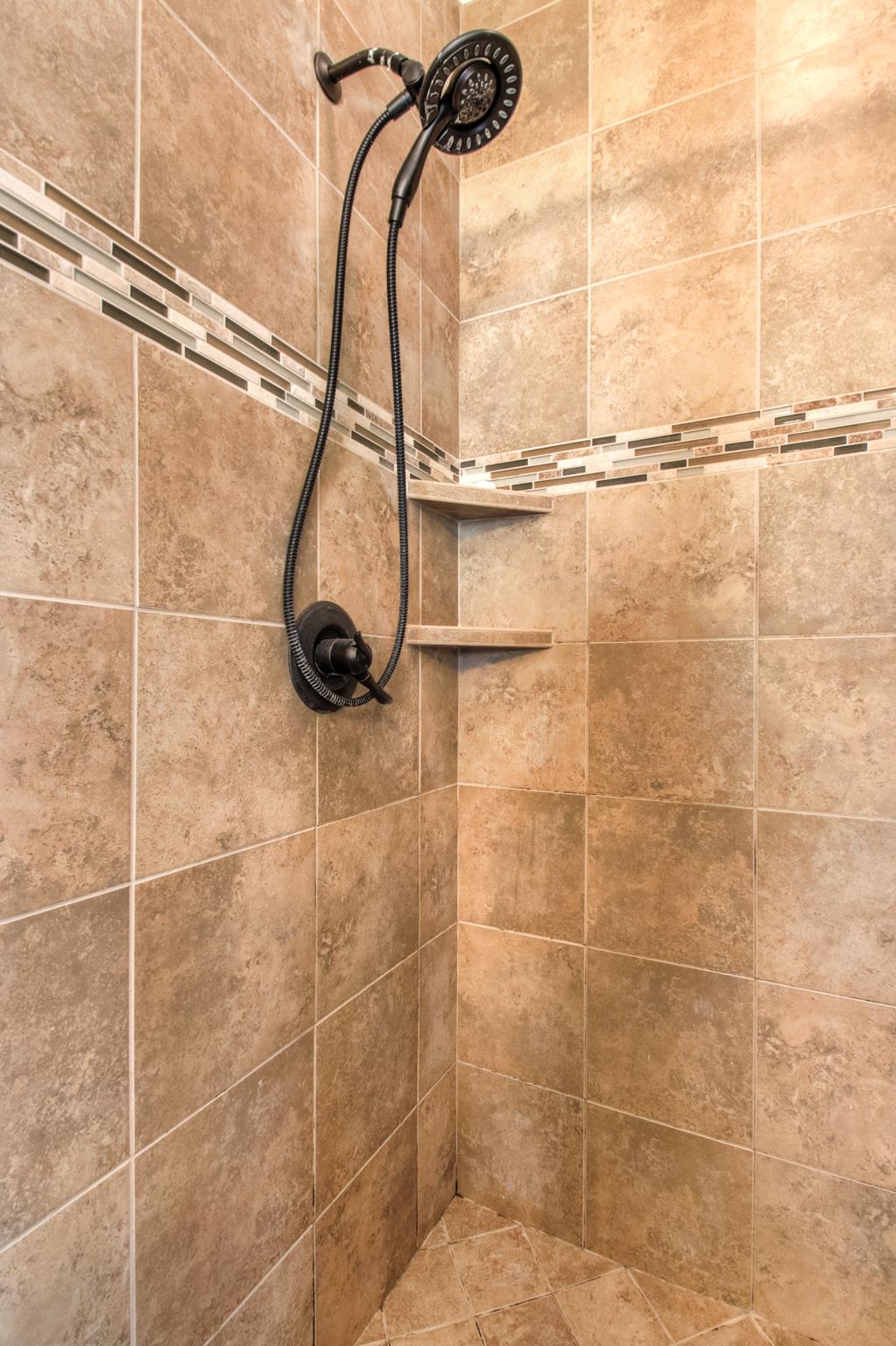 7675 Knobdate Road Smyrna, TN 37167 - Photo 17 of 26 Separate shower and tub with custom tile styling